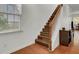 Staircase with wood flooring and white railing at 406 Bear Tree Ct, Moncks Corner, SC 29461