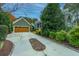 Long driveway with brick accents leading to a two car garage at 4118 E Amy Ln, Johns Island, SC 29455