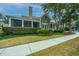 House exterior with a screened porch and manicured landscaping at 4118 E Amy Ln, Johns Island, SC 29455