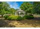 White gazebo nestled in a lush green garden at 4118 E Amy Ln, Johns Island, SC 29455