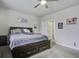 Main bedroom with king-size bed, ceiling fan, and en-suite bathroom access at 435 Eva St, Moncks Corner, SC 29461