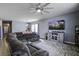 Relaxing living room with sectional sofa, large TV, and decorative rug at 435 Eva St, Moncks Corner, SC 29461