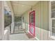 Front porch with rocking chairs and red door at 4401 Prices Bridge Ln, Walterboro, SC 29488