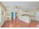 Open living space with hardwood floors, kitchen island, and ceiling fan at 4401 Prices Bridge Ln, Walterboro, SC 29488