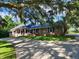 Brick home with blue shutters and American flag at 4627 Shark Hole Rd, Meggett, SC 29449