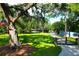 Large oak tree and home with metal fence at 4627 Shark Hole Rd, Meggett, SC 29449