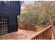 Spacious wooden deck with fall leaves, offering serene wooded views at 6464 St Anthony Dr, Hollywood, SC 29449