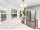 Updated kitchen with stainless steel refrigerator and a view into the dining area at 733 Gilmore Ct, Charleston, SC 29412