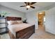 Spacious bedroom with a wooden bed frame and ceiling fan at 945 E Estates Blvd # D, Charleston, SC 29414