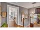 Upstairs hallway with hardwood floors and access to bedrooms at 99 King St, Charleston, SC 29401