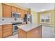 Bright kitchen with wood cabinets and an island at 109 Billowing Sails St, Summerville, SC 29486