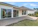 Brick paver patio with awning and sliding glass doors at 109 Billowing Sails St, Summerville, SC 29486