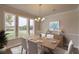 Bright dining room featuring a wood table and white chairs at 149 Winding Grove Ln, Moncks Corner, SC 29461