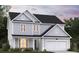 Two-story home with gray siding, white trim, and a two-car garage at 149 Winding Grove Ln, Moncks Corner, SC 29461