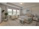 Relaxing main bedroom with large windows and neutral decor at 149 Winding Grove Ln, Moncks Corner, SC 29461