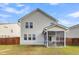 Two-story house with fenced backyard, screened porch, and grassy lawn at 223 Laurel Crest Way, Summerville, SC 29486