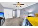 Spacious bedroom with a crib, ceiling fan, and TV at 223 Laurel Crest Way, Summerville, SC 29486