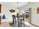 Breakfast nook with glass table and sliding door access to backyard at 223 Laurel Crest Way, Summerville, SC 29486
