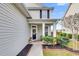 Inviting front porch with seating area and decorative wreath at 223 Laurel Crest Way, Summerville, SC 29486