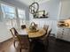 Charming dining area with a round wooden table and wicker chairs at 3105 Sturbridge Rd, Mount Pleasant, SC 29466