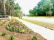 Landscaped sidewalk and street in a quiet neighborhood at 7026 Deanston Dr, Ravenel, SC 29470