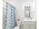 Simple bathroom with shower/tub combo, toilet and white vanity at 823 Recess Point Dr, Moncks Corner, SC 29461