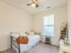 Bedroom with daybed, window, and decorative ladder shelf at 823 Recess Point Dr, Moncks Corner, SC 29461
