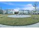 Community fire pit area with homes in the background at 823 Recess Point Dr, Moncks Corner, SC 29461