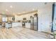 Open concept kitchen with white cabinets, granite countertops, and stainless steel appliances at 823 Recess Point Dr, Moncks Corner, SC 29461