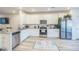 Modern kitchen with white cabinets, granite countertops, and stainless steel appliances at 823 Recess Point Dr, Moncks Corner, SC 29461