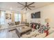 Cozy living room featuring comfy sofas, a large TV, and a ceiling fan at 823 Recess Point Dr, Moncks Corner, SC 29461