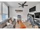 Home office with a leather couch, a wood bench, and a gaming setup at 823 Recess Point Dr, Moncks Corner, SC 29461