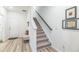 Modern carpeted staircase with a simple dark wood handrail at 823 Recess Point Dr, Moncks Corner, SC 29461