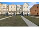 Three-story townhouses with front yards and sidewalks at 823 Recess Point Dr, Moncks Corner, SC 29461