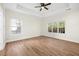 Well-lit bedroom with ceiling fan and hardwood floors at 102 Kapalua Run, Summerville, SC 29483