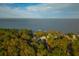 Aerial view of waterfront property with fall foliage and private pier at 109 Beacon Ave, Moncks Corner, SC 29461