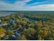 Aerial view showing home's location in a wooded neighborhood near the water at 109 Beacon Ave, Moncks Corner, SC 29461