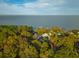 House nestled in wooded area near waterfront at 109 Beacon Ave, Moncks Corner, SC 29461