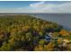 House near waterfront, surrounded by trees at 109 Beacon Ave, Moncks Corner, SC 29461