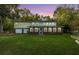 Two-story house with attached garage and landscaped lawn at dusk at 109 Beacon Ave, Moncks Corner, SC 29461