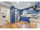 Modern kitchen with blue cabinetry, granite counters and stainless steel appliances at 109 Beacon Ave, Moncks Corner, SC 29461