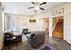 Cozy living room with a fireplace, comfortable seating, and large windows at 109 Beacon Ave, Moncks Corner, SC 29461