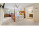 Main bedroom with a king-size bed and ensuite bathroom at 109 Beacon Ave, Moncks Corner, SC 29461
