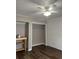 Bedroom with wood-look floors, ceiling fan and closet at 114 Lewisfield Dr, North Charleston, SC 29418