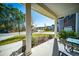 Covered front porch with seating area overlooking the neighborhood at 117 Guinness Ln, Moncks Corner, SC 29461