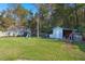 Large backyard with playset, shed, and firepit at 120 Sandy Dr, Moncks Corner, SC 29461