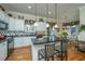 Spacious kitchen with white cabinets, black countertops, and island at 1223 White Tail Path, Charleston, SC 29414