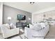 Living room features a gray accent wall, comfy seating and open floor plan at 185 Surf Bird Rd # 506P, Summerville, SC 29486