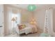 Charming bedroom with a daybed, whimsical decor, and a canopy at 231 Dean Hall Ave, Moncks Corner, SC 29461