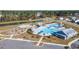 Aerial view of community pool, playground, and surrounding homes at 314 Black Birch Dr, Summerville, SC 29486
